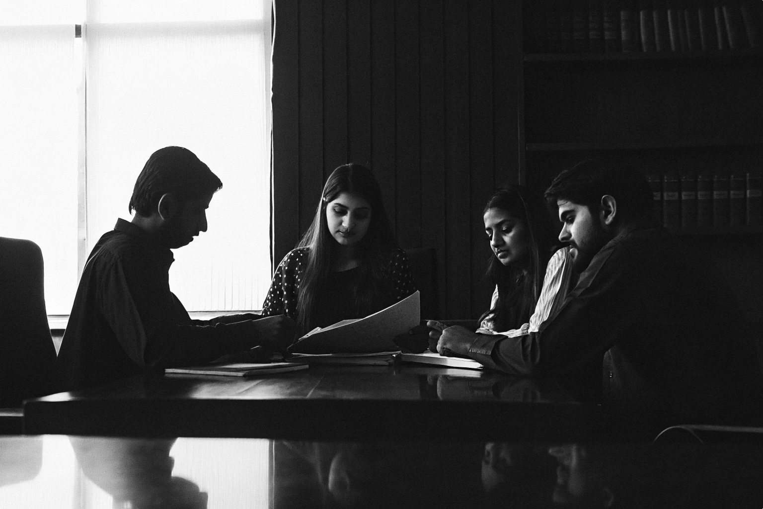 Professionals discussing workplace learning materials